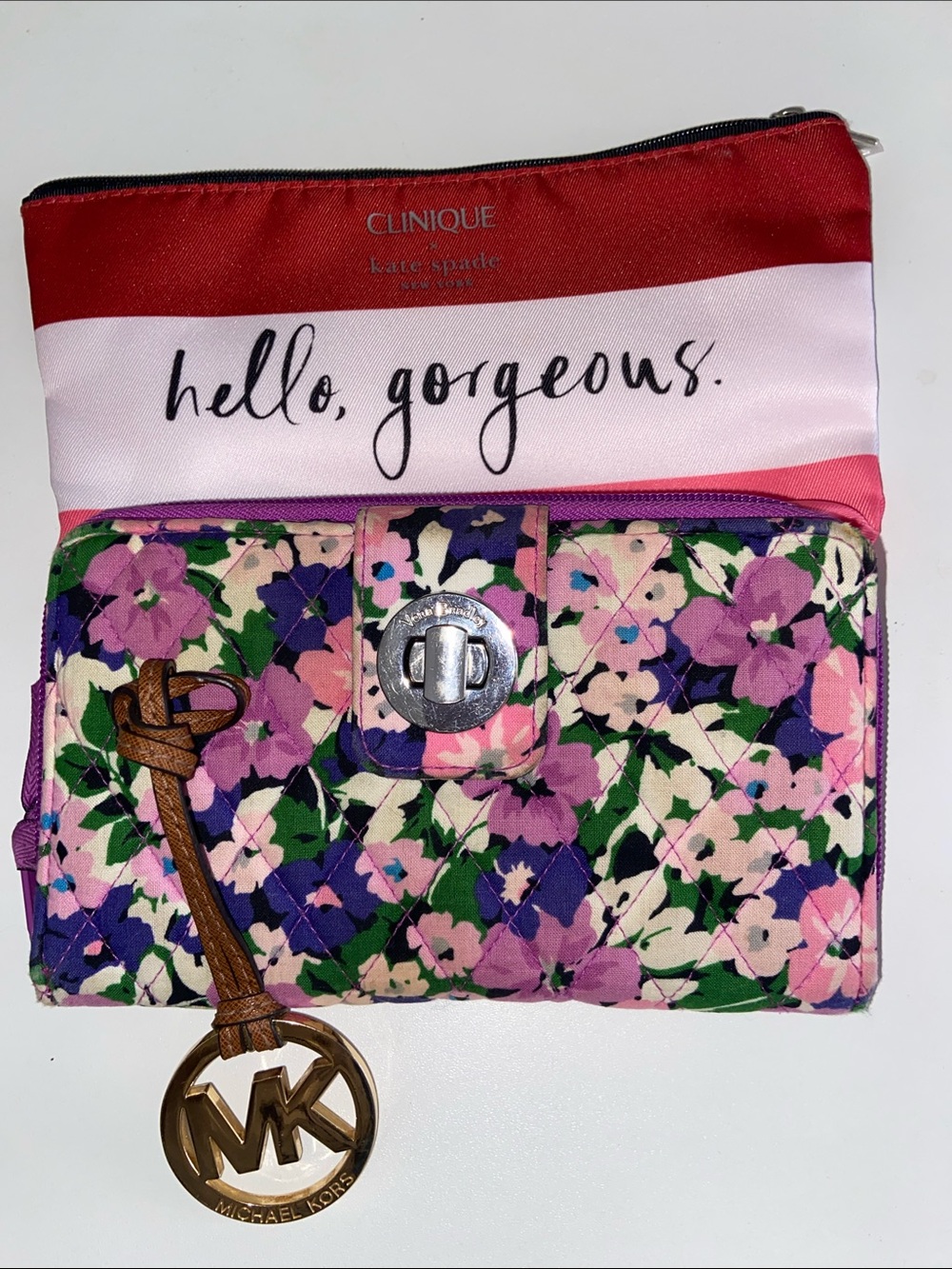 Kate Spade makeup bag by Clinic Michael Kors bag tag Vera Bradley wallet